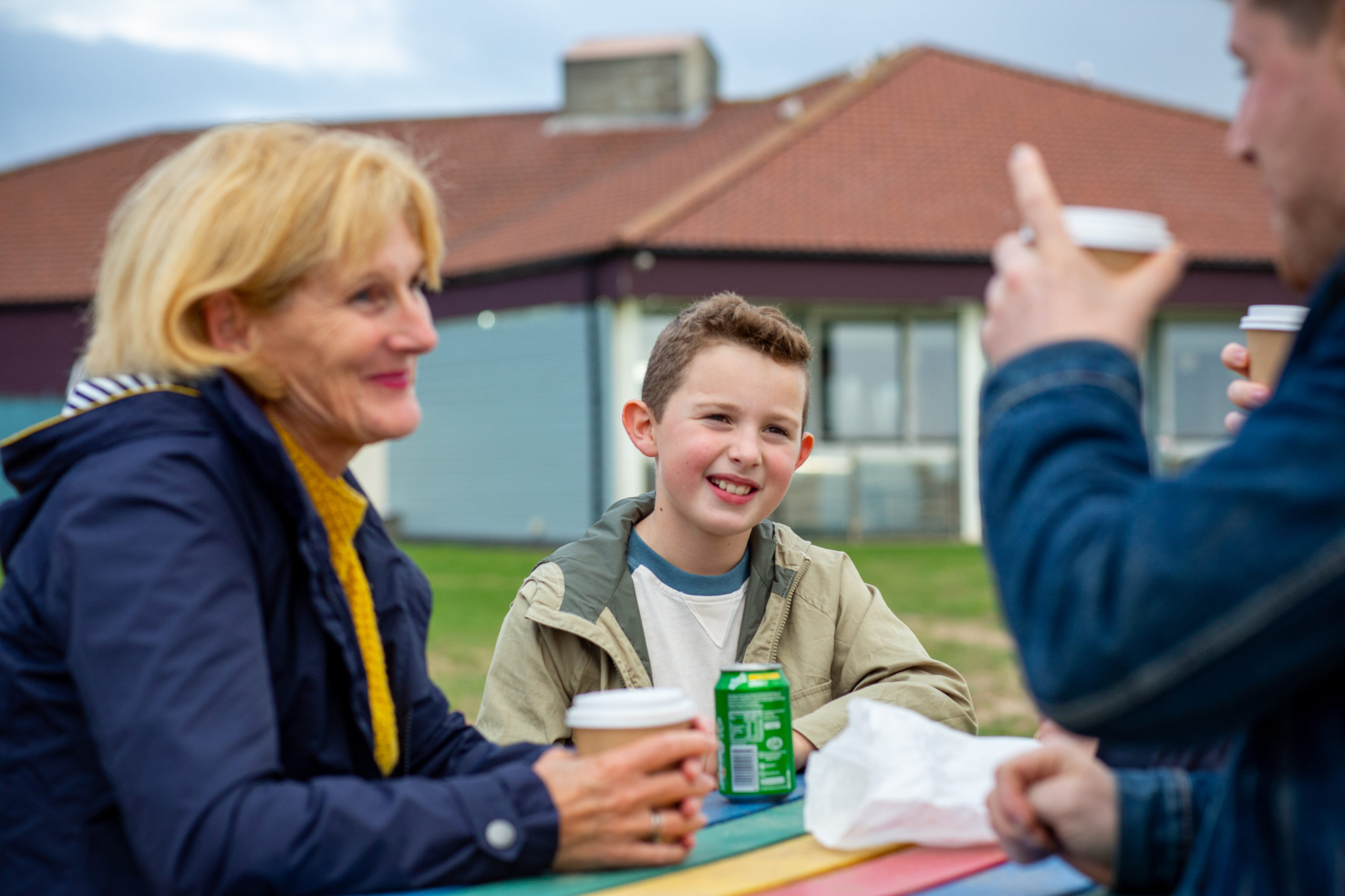 woman smiling and son overlooking
