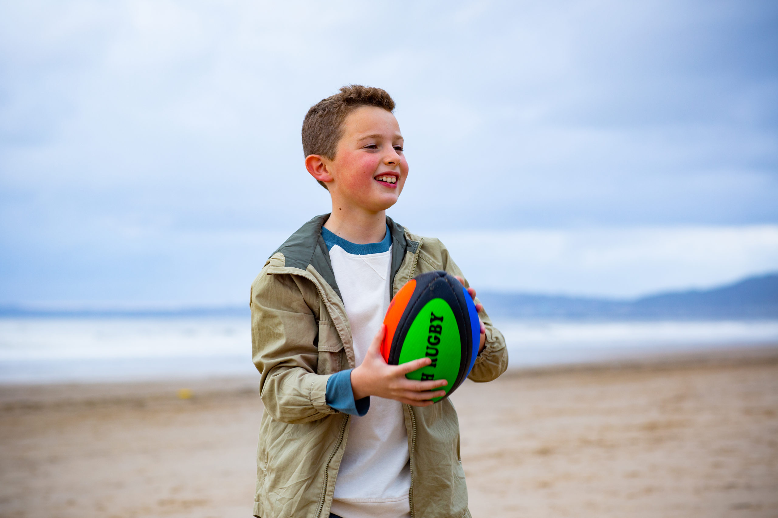 young boy playing with a ball